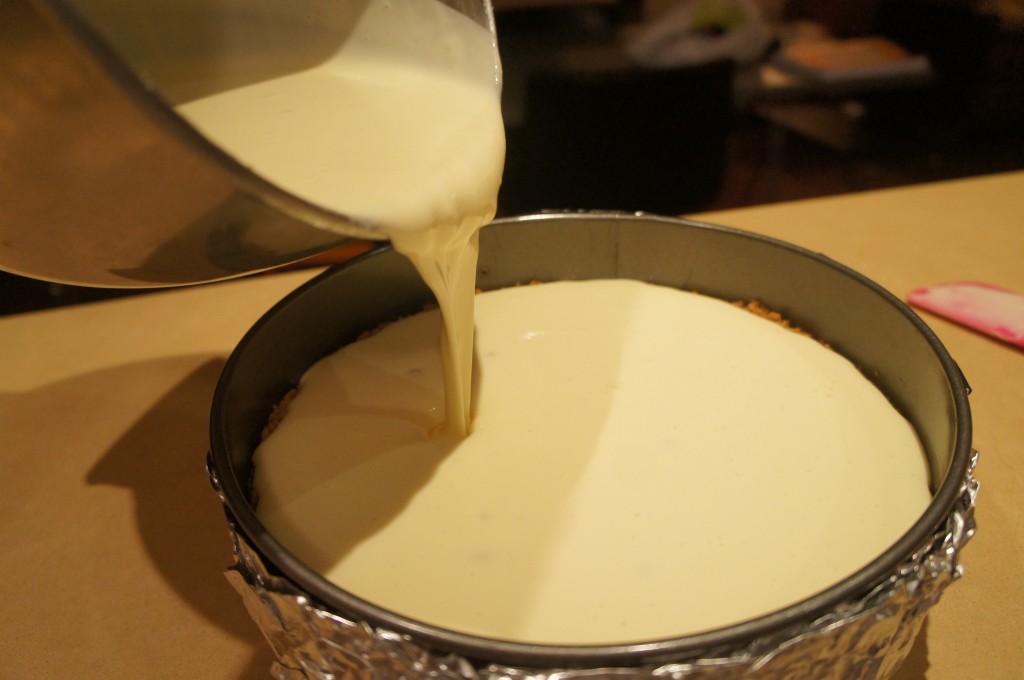 cheesecake pouring into pan